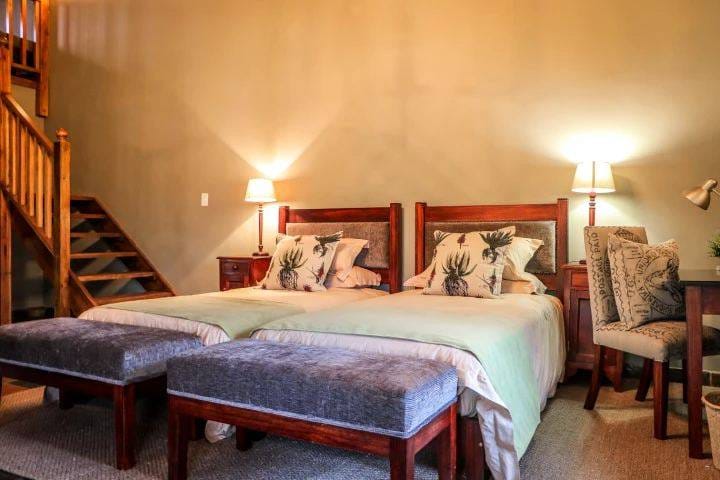 Chalet bedroom with twin beds and warm lamplight