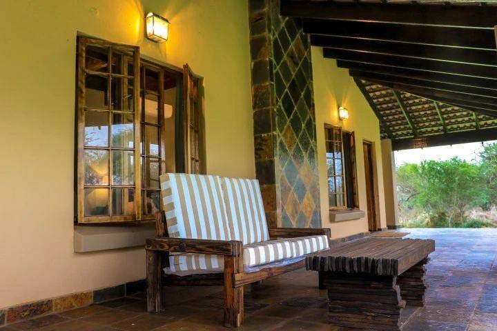 Chalet veranda with seating overlooking the bushveld