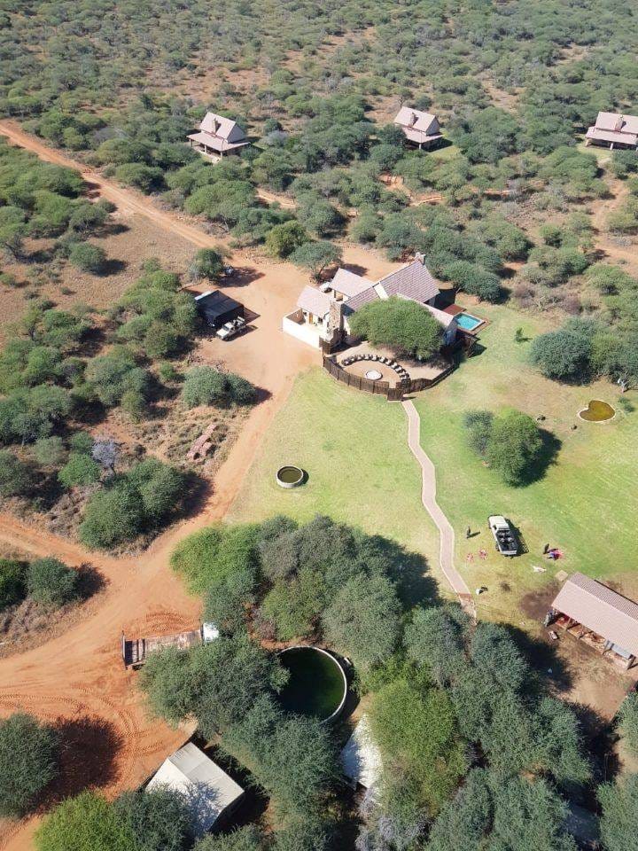 Aerial view of Sand River Safari Lodge — main lodge and surrounding chalets